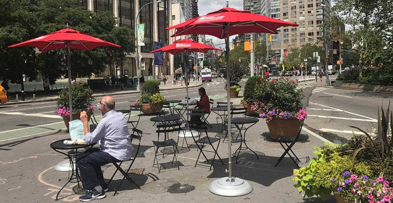 New umbrellas at Dante Park's extended tip.