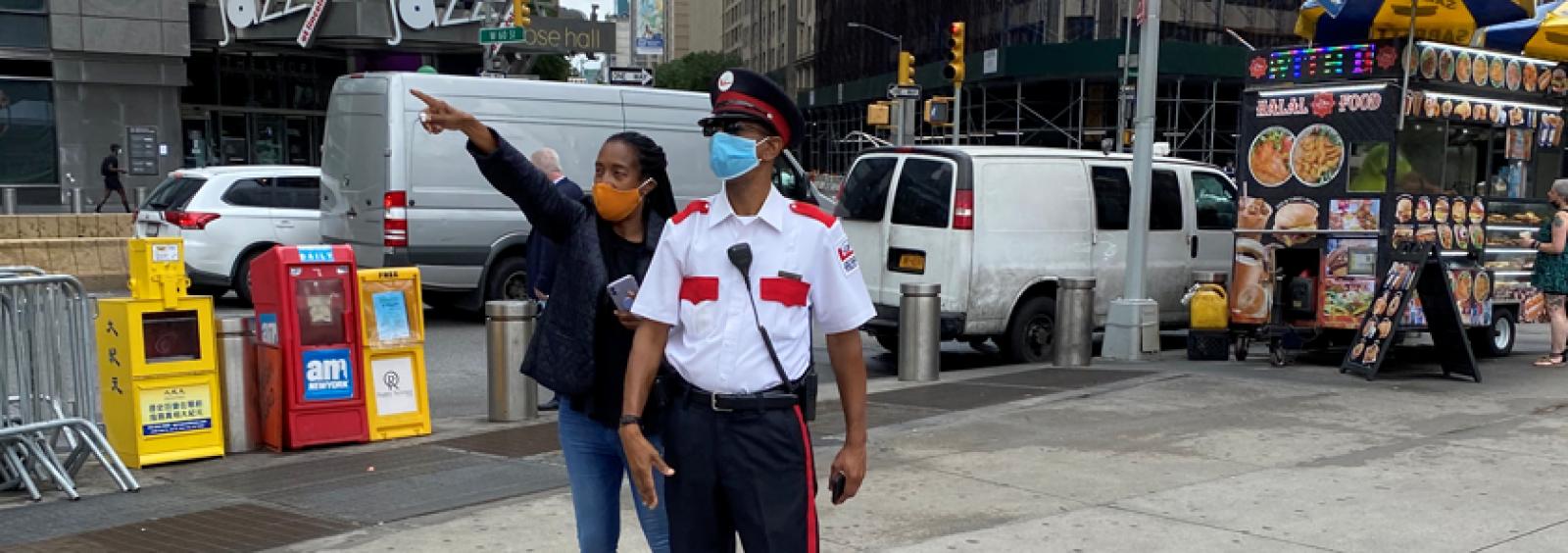 public safety officer helping a pedestrian with directions
