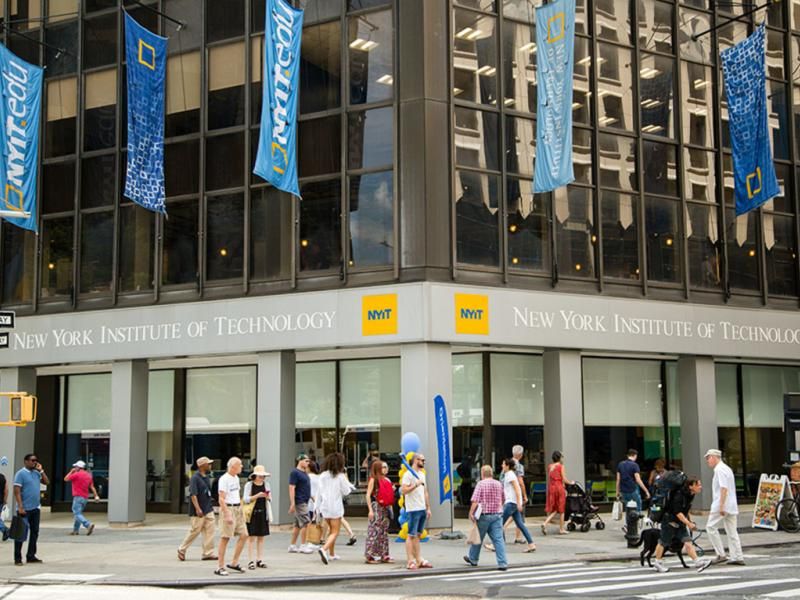 pedestrians and students pass in front of NYIT's manhattan building on Broadway and 61st Street