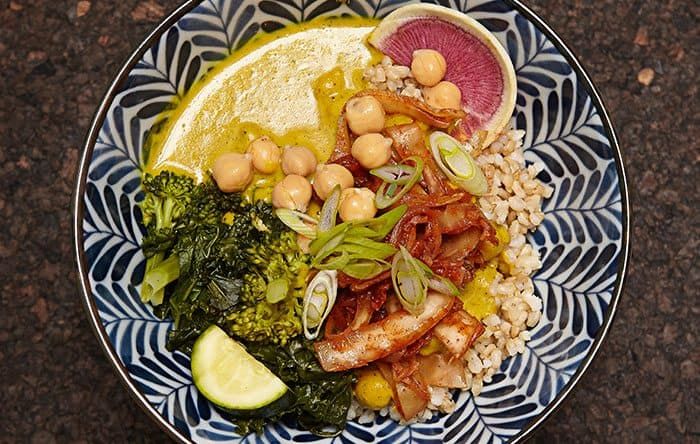 a plate of vegan curry over rice with chickpeas broccoli and more from Le Bontaniste