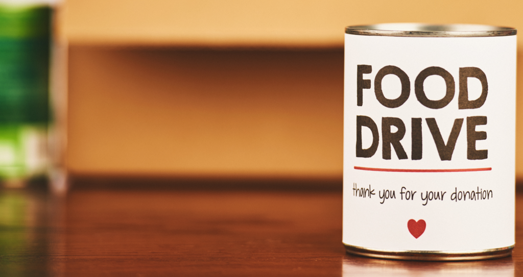Can that says "Food Drive" sits on a table
