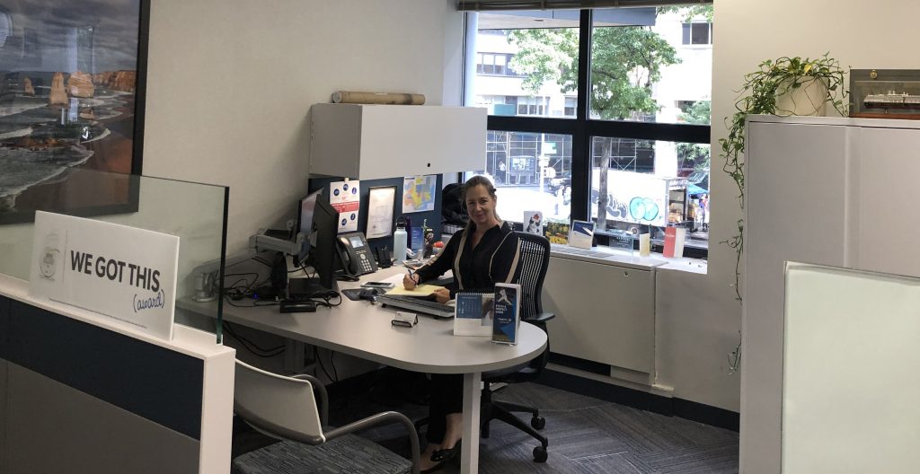 Manhattan Agent Joan sits at her desk in the AAA office at 1881 Broadway