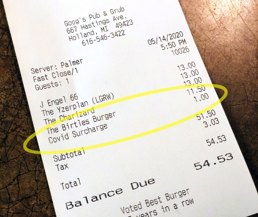restaurant bill with a surcharge on it