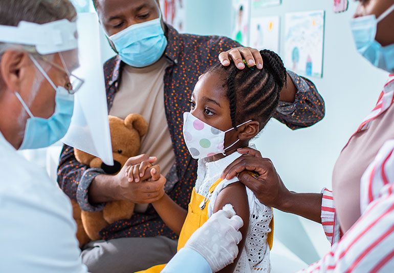 child receiving vaccine