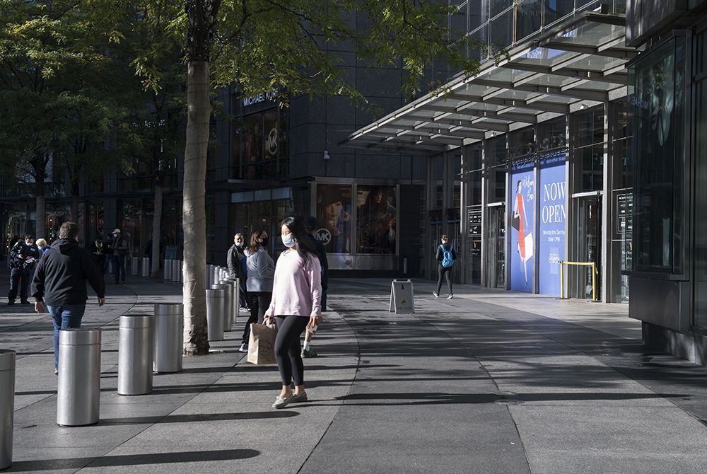 pedestrians outside of the shops at columbus circle