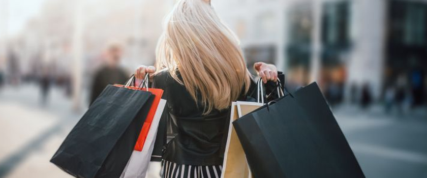 woman holding shopping bags