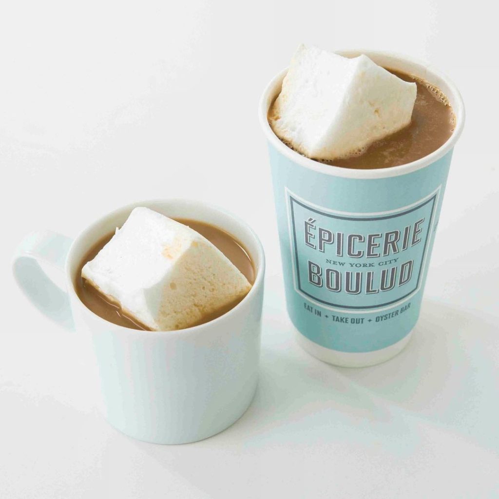 hot cocoa in a mug and in a to-go cup sitting next to each other from Epicerie Boulud