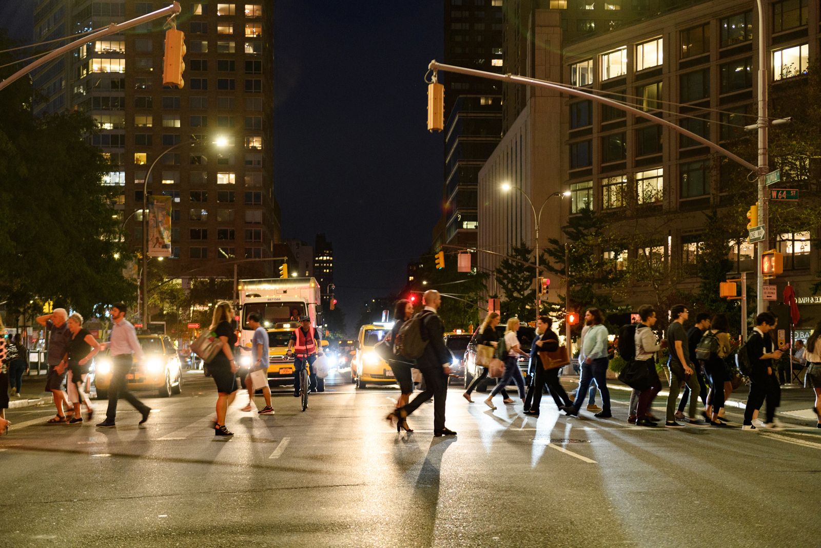 crowds moving through a crosswalk in Lincoln Square at 64th Street