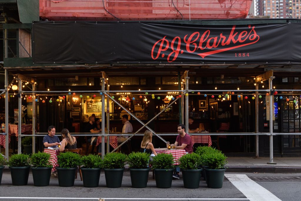 people dining outside pj clarke's