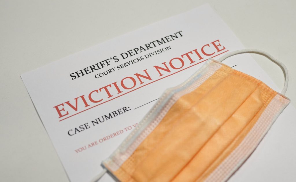 face mask over an eviction notice