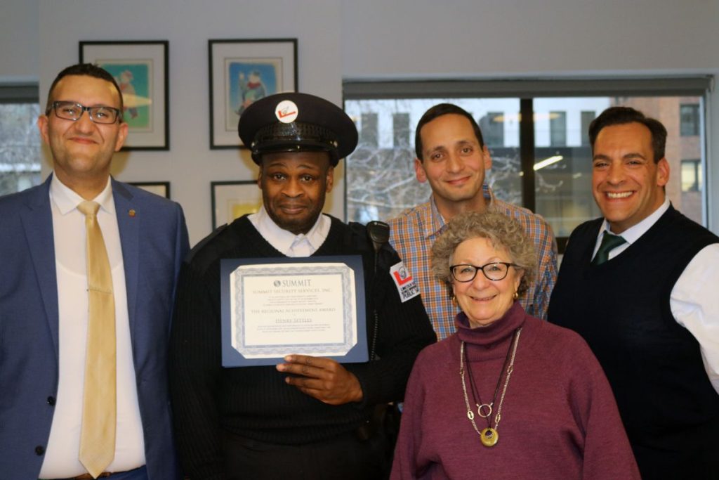 LSBID President_ Monica Blum_ Director of Operations Phil Gordon_ Executive Vice President Ralph Memoli_ Public Safety Supervisor Henry Settles_ and a representative from Summit Security pose for a photo