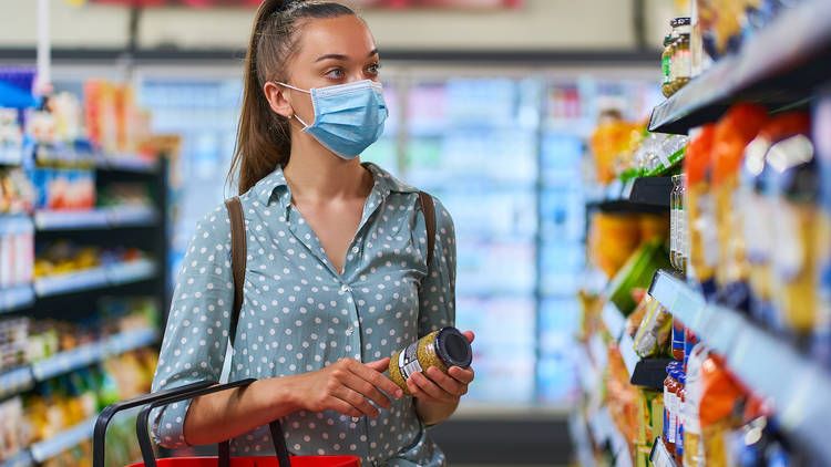 woman wearing mask in a shop
