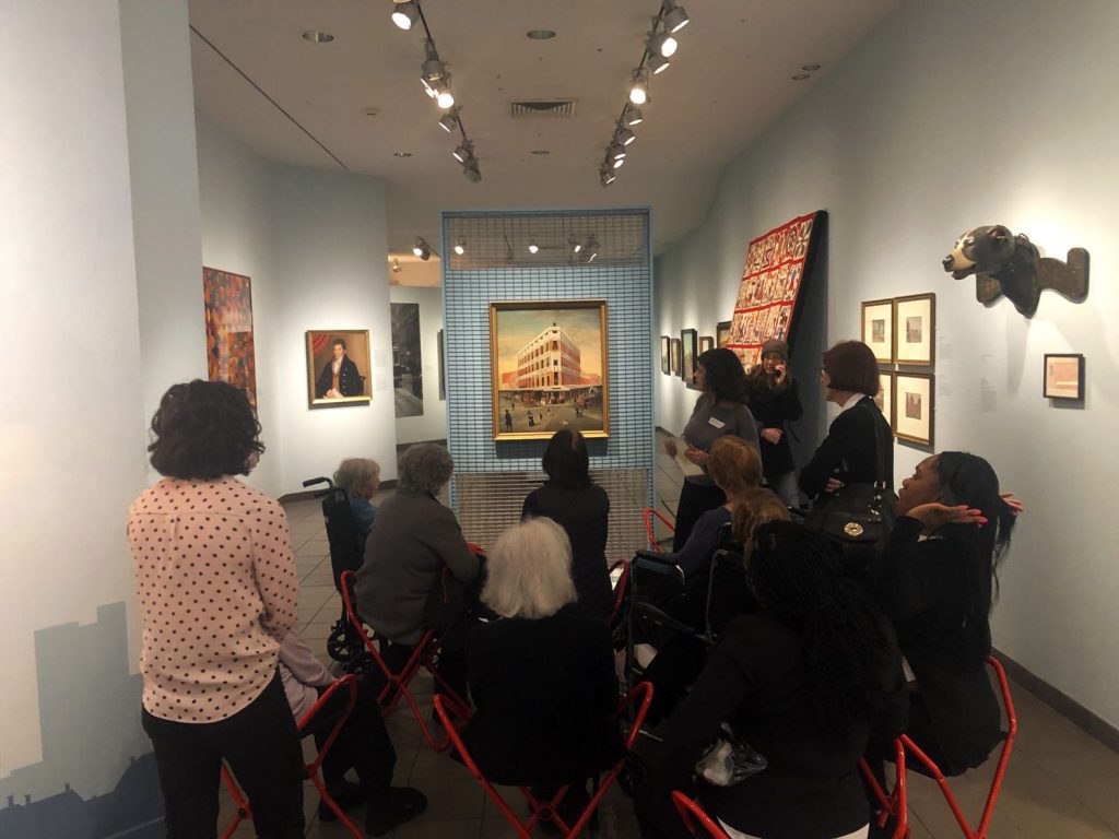 Museum patrons admire art in the American Folk Art Museum's new exhibit ----