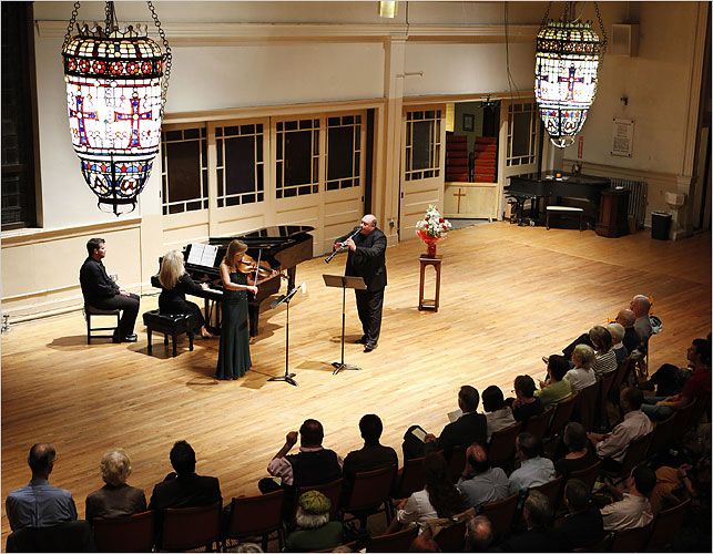 players perform before an audience at the church of st paul