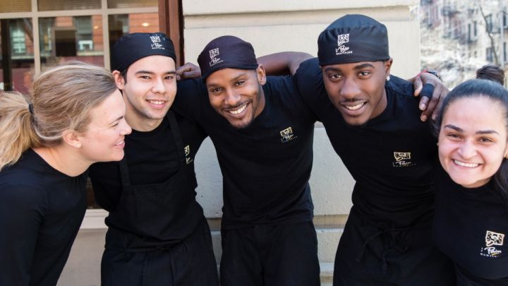 staff from Le Pain Quotidien pose for a photo together in uniform