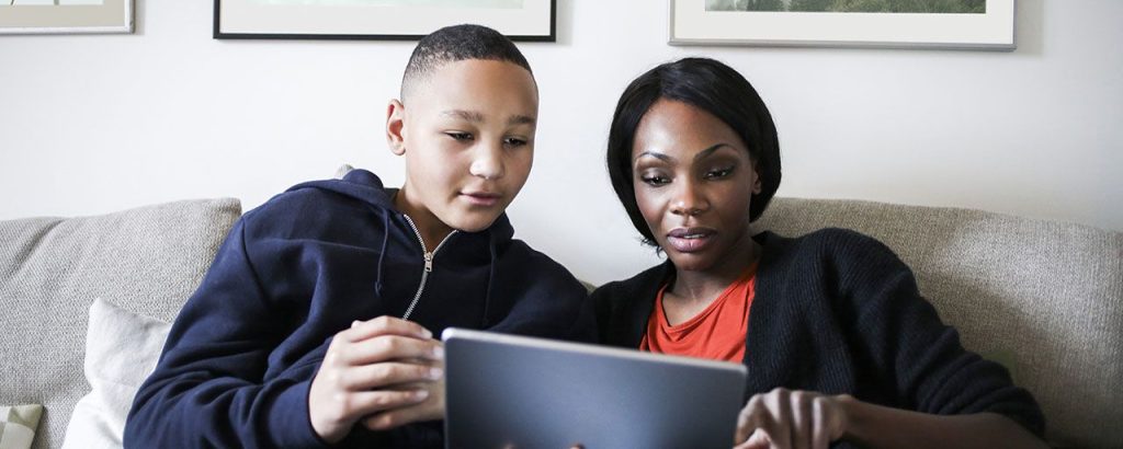 mom and son on a tablet