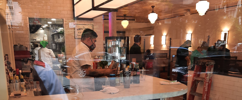 people working on the interior of old john's diner