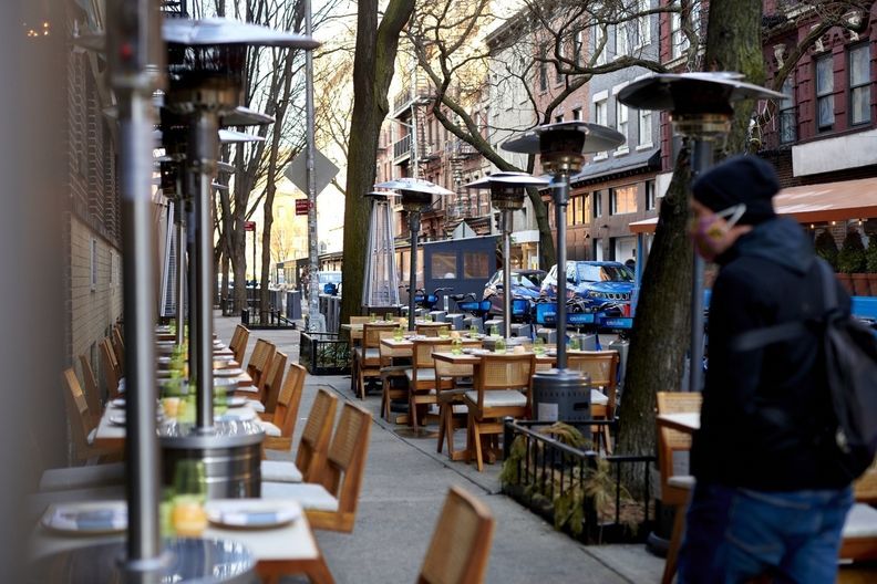 outdoor dining set up with propane heaters