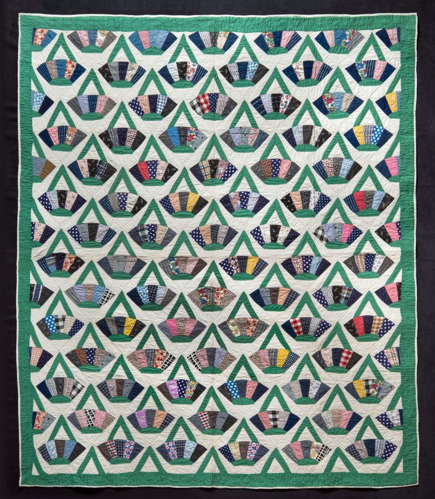 quilt with a basket like pattern in many colors with each patch of fabric used in the design a unique pattern