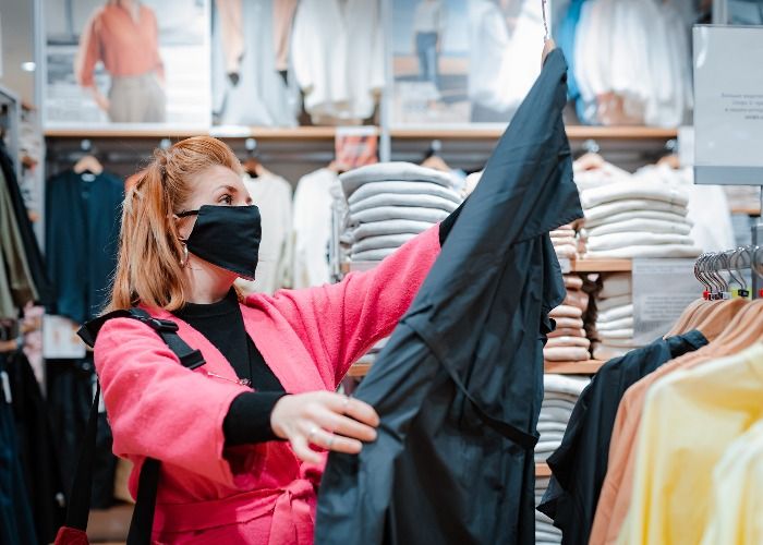 woman wearing a mask while shopping