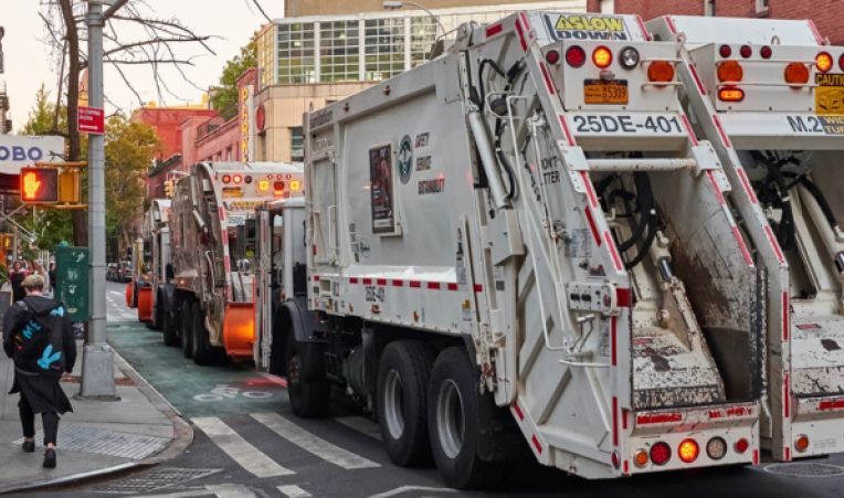 garbage truck on the streets of nyc