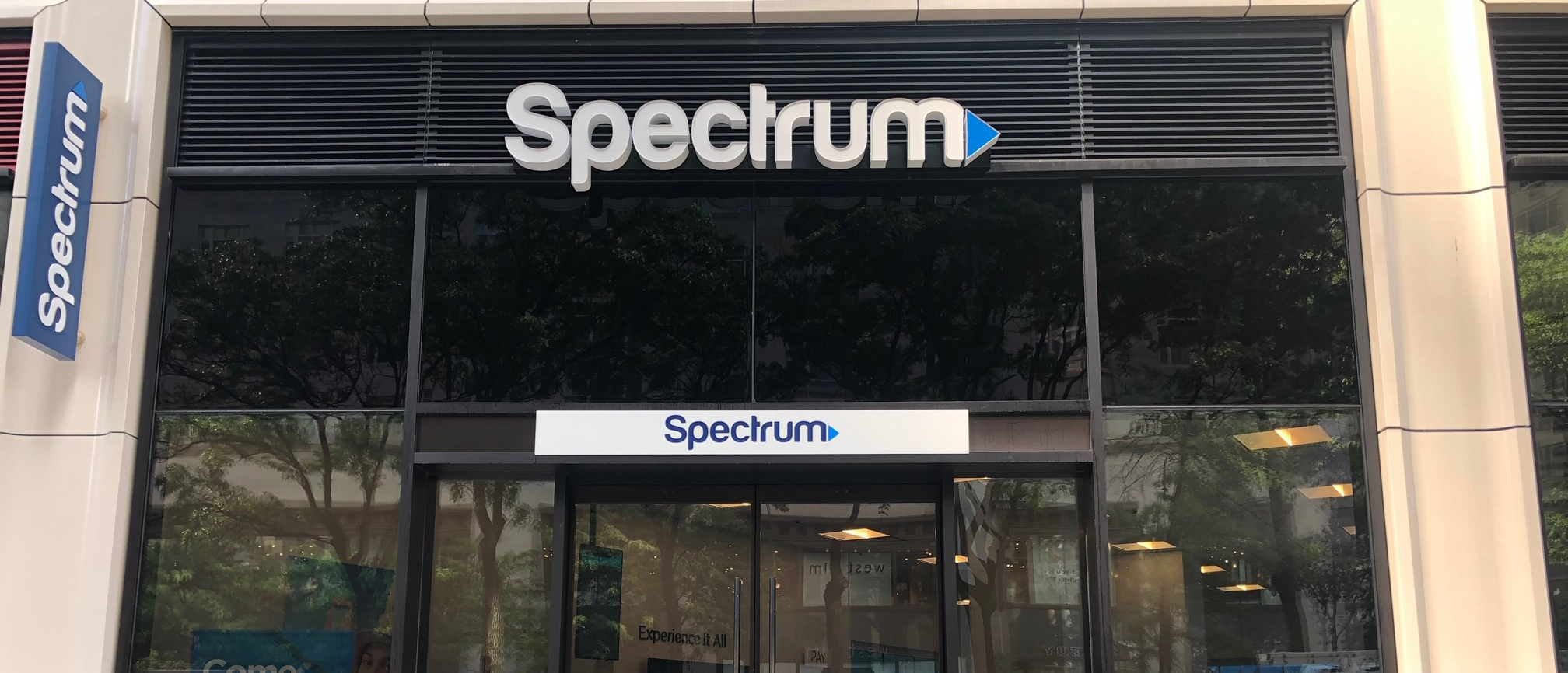 the outside of Spectrum with signage on Broadway at 61st Street
