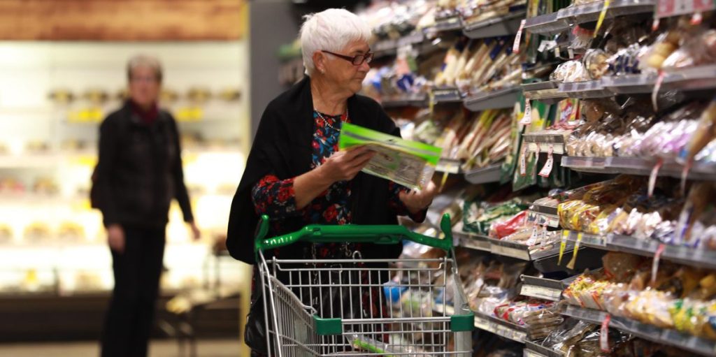 an older woman shops for groceries
