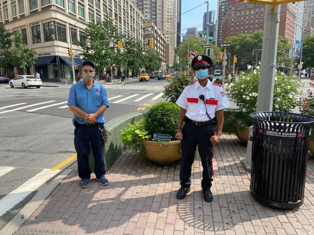 clean team supervisor tony and public safety officer lincoln standing near each other