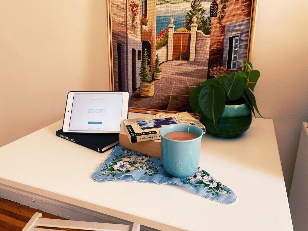 set up of tablet and book and tea