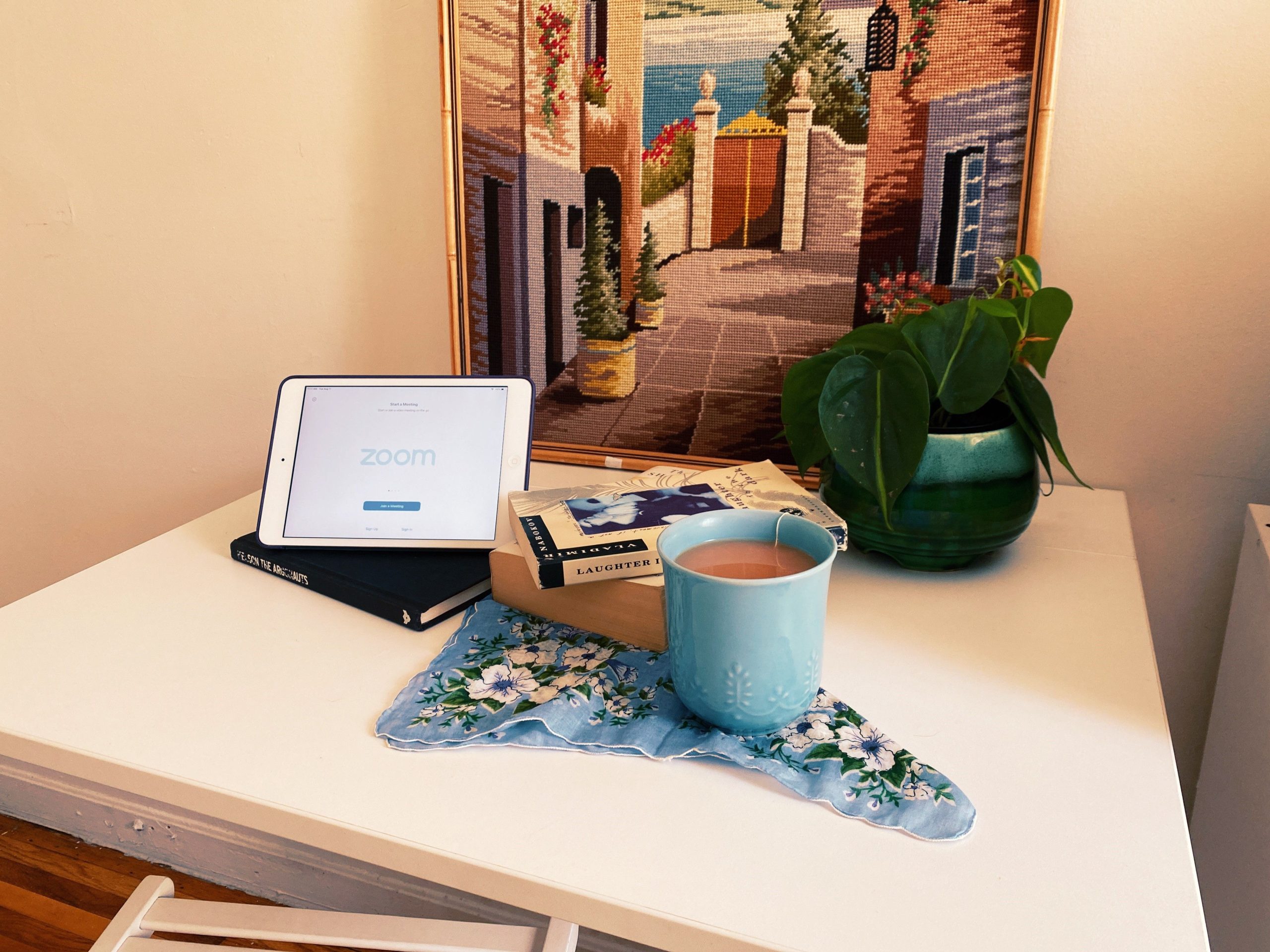set up of tablet and book and tea