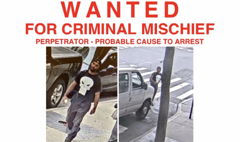 wanted sign for man in black outfit