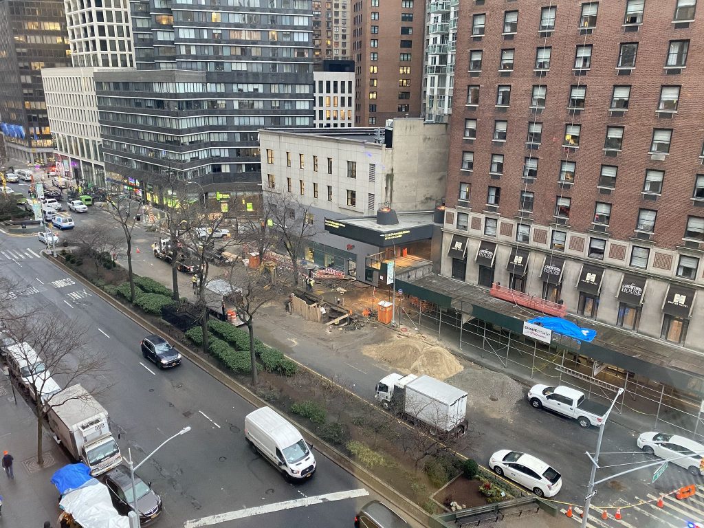 view of the street work happening on Broadway at 62nd Street  due to the water main break