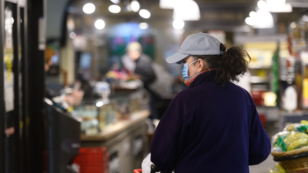woman shopping with a face mask on