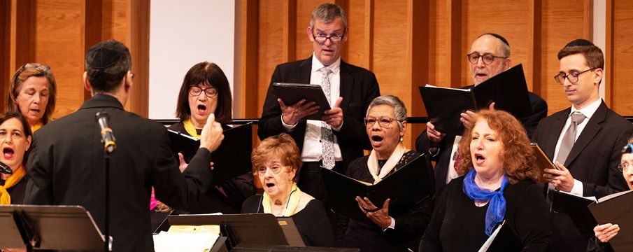 Photo of adults singing in a choir at Kaufman Music Center
