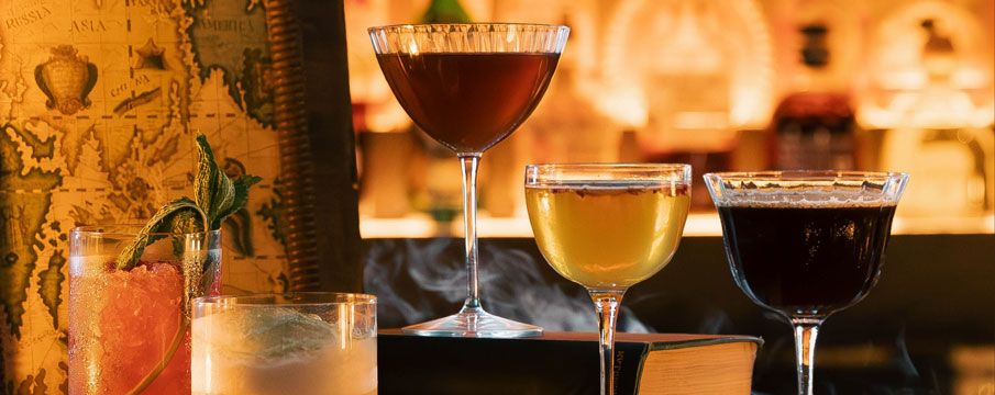 Photo of different types of cocktails on a bar