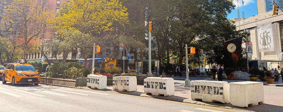 Photo of a line of NYPD traffic blocks