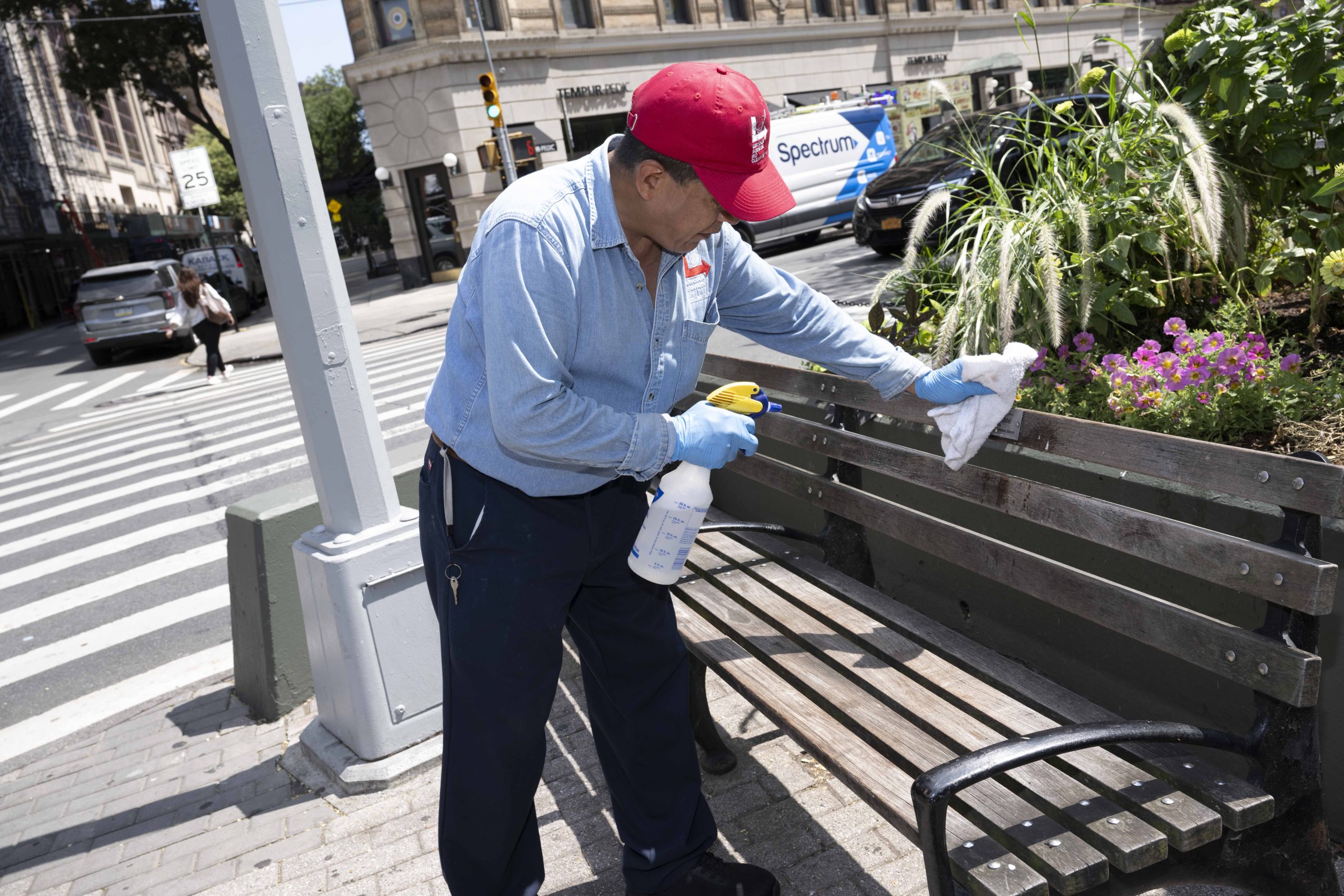 Clean Team member cleaning a bench