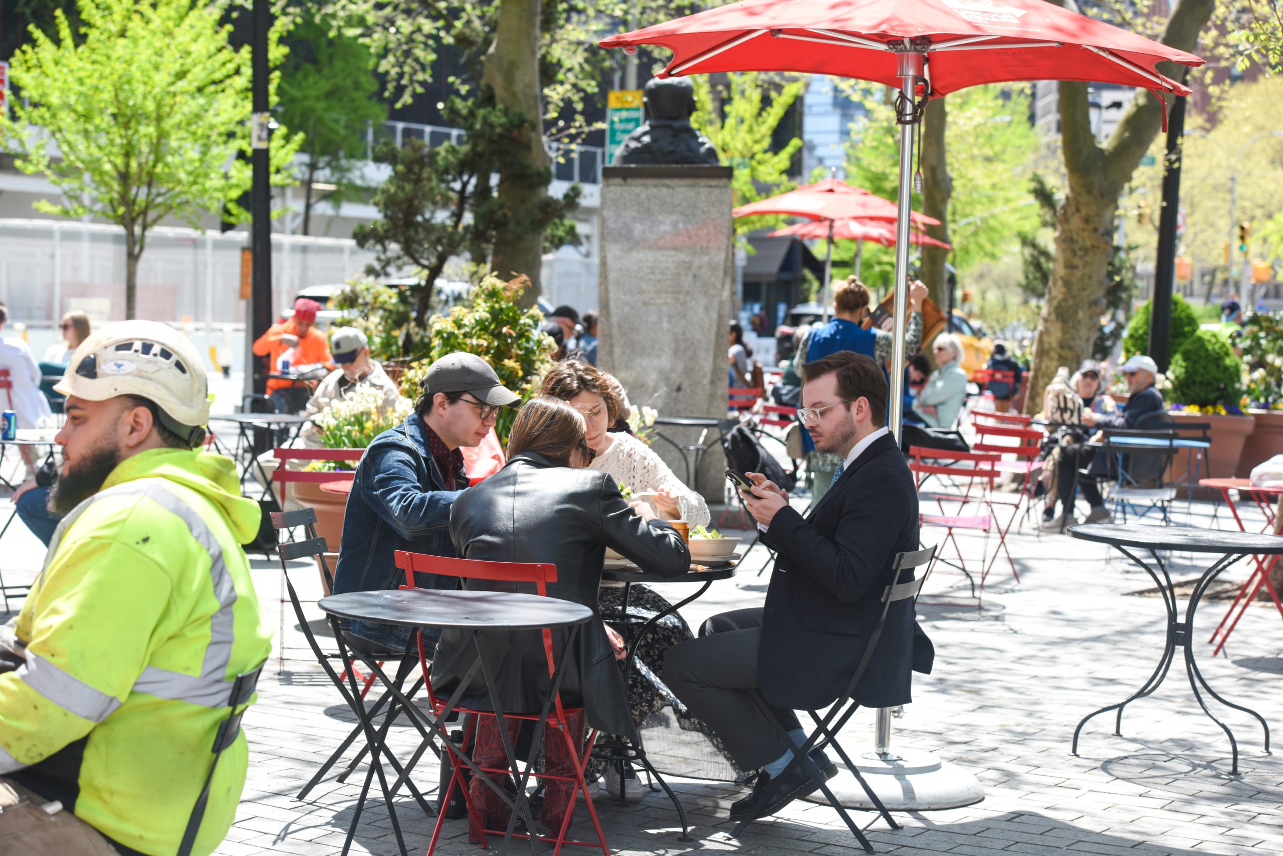 People sitting in Richard Tucker Park